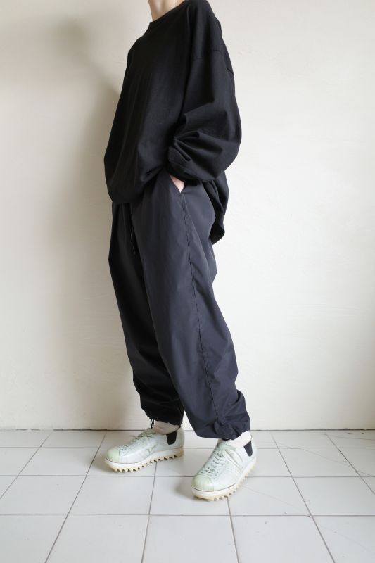 UNTRACE WATER REPELLENT TAPERED STRETCH TRACK PANTS・BLACK - tity